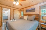 Main Level Master Suite Features King Bed, Flat Screen Tv, Private Bath, and Access to Covered Deck